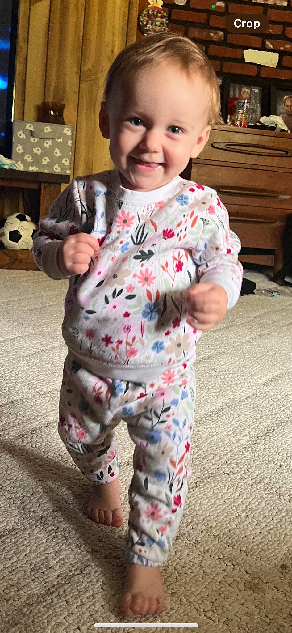 Presley is registered to the contest to win money with this photo: baby, baby_toddler_clothing, ball, bench, cabinetry, cheek, child, flooring, fun, happy, joy, nightwear, pajamas, pattern, person, skin, sleeve, smile, standing, t_shirt