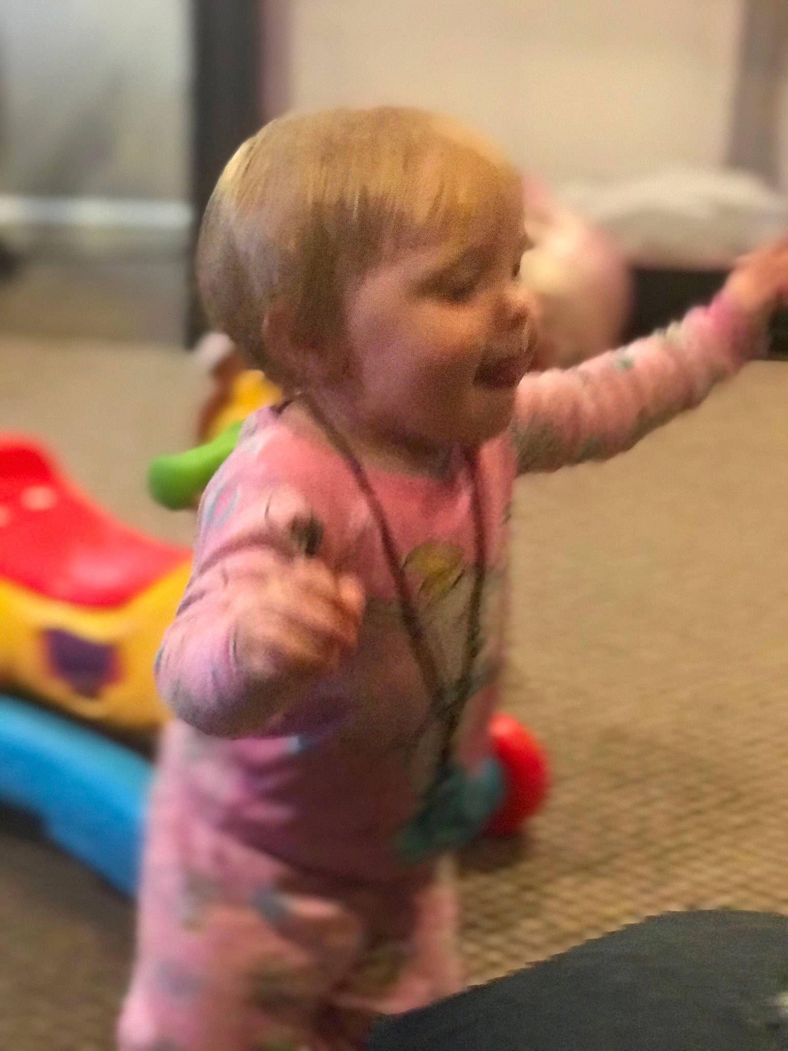 Everly is registered to the contest to win money with this photo: baby, baby_products, baby_toddler_clothing, baby_toys, cheek, child, finger, person, pink, plastic, play, skin, thumb, toddler, toy