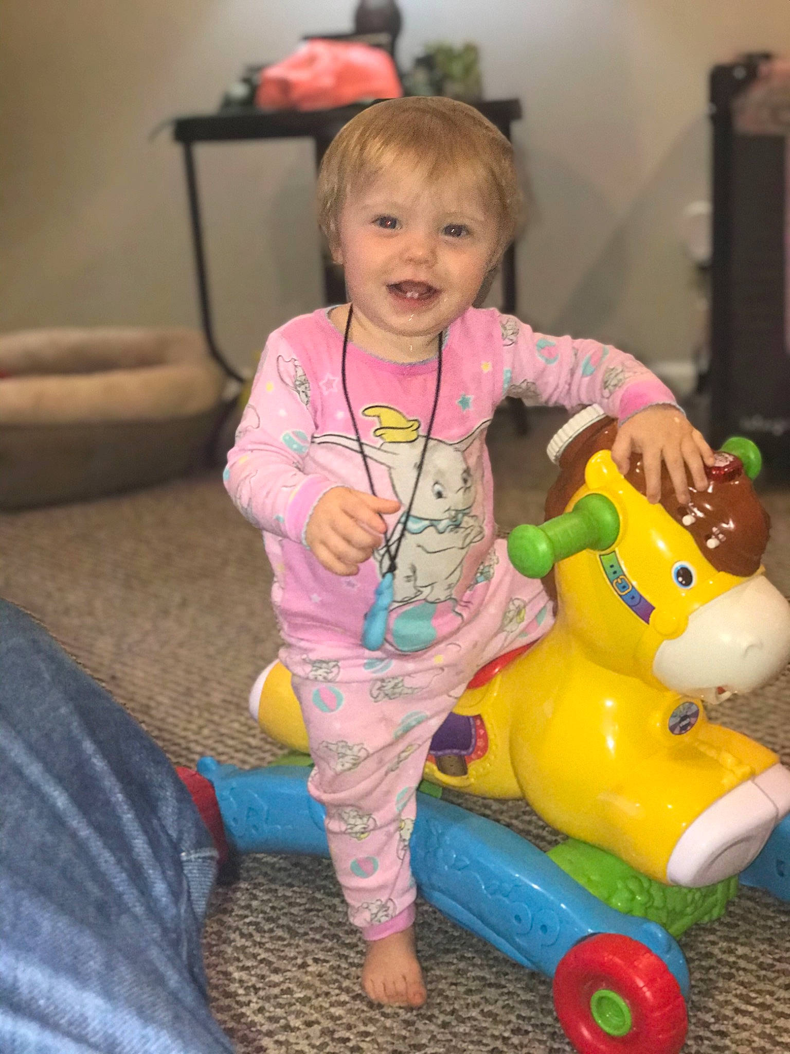 Everly is registered to the contest to win money with this photo: baby, baby_playing_with_toys, baby_products, baby_toddler_clothing, baby_toys, child, joy, livestock, living_room, loudspeaker, person, pink, plastic, play, playground, riding_toy, toddler, toy