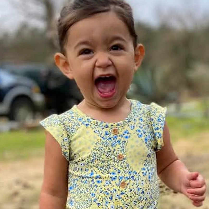 Lainey is registered to the contest to win money with this photo: baby, babylaughing, clothing, crying, dress, face, happy, head, laughing, person, photography, portrait, sad