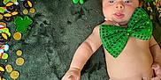 Ragnar is registered to the contest to win money with this photo: adorable, baby, blanket, celebration, child, cute, diaper, festive, four_leaf_clover, glowing_lights, gold_coins, green_bow, holiday, indoors, infant, lying_down, rainbow, shamrock, smiling_face, st_patricks_day