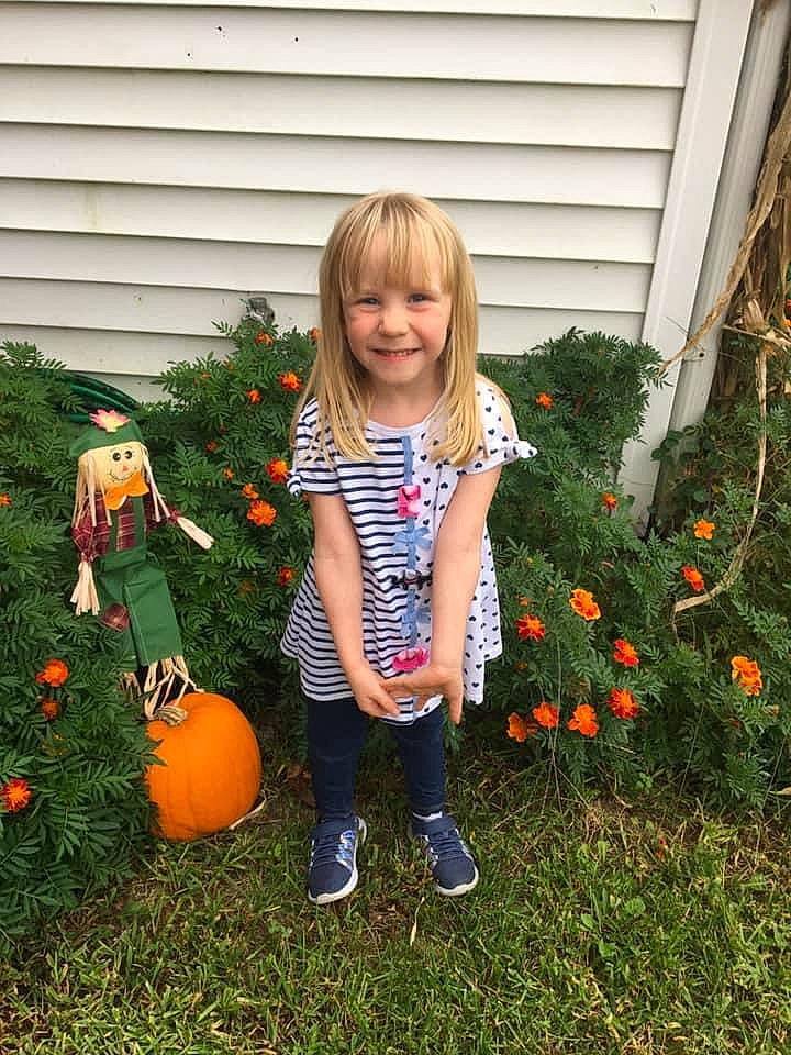 Annalee is registered to the contest to win money with this photo: backyard, calabaza, child, cucurbita, fruit, garden, grass, holiday, joy, person, plant, pumpkin, toddler, tree, winter_squash, yard