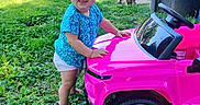 Annabelle joined the competition — help win amazing prizes! baby, blue_truck, child, dog, driveway, grass, outdoor, outdoors, pet, pink_truck, playtime, portrait, residential_area, smiling, summer, sunlight, toddler, toy_truck, toy_vehicle, vehicles