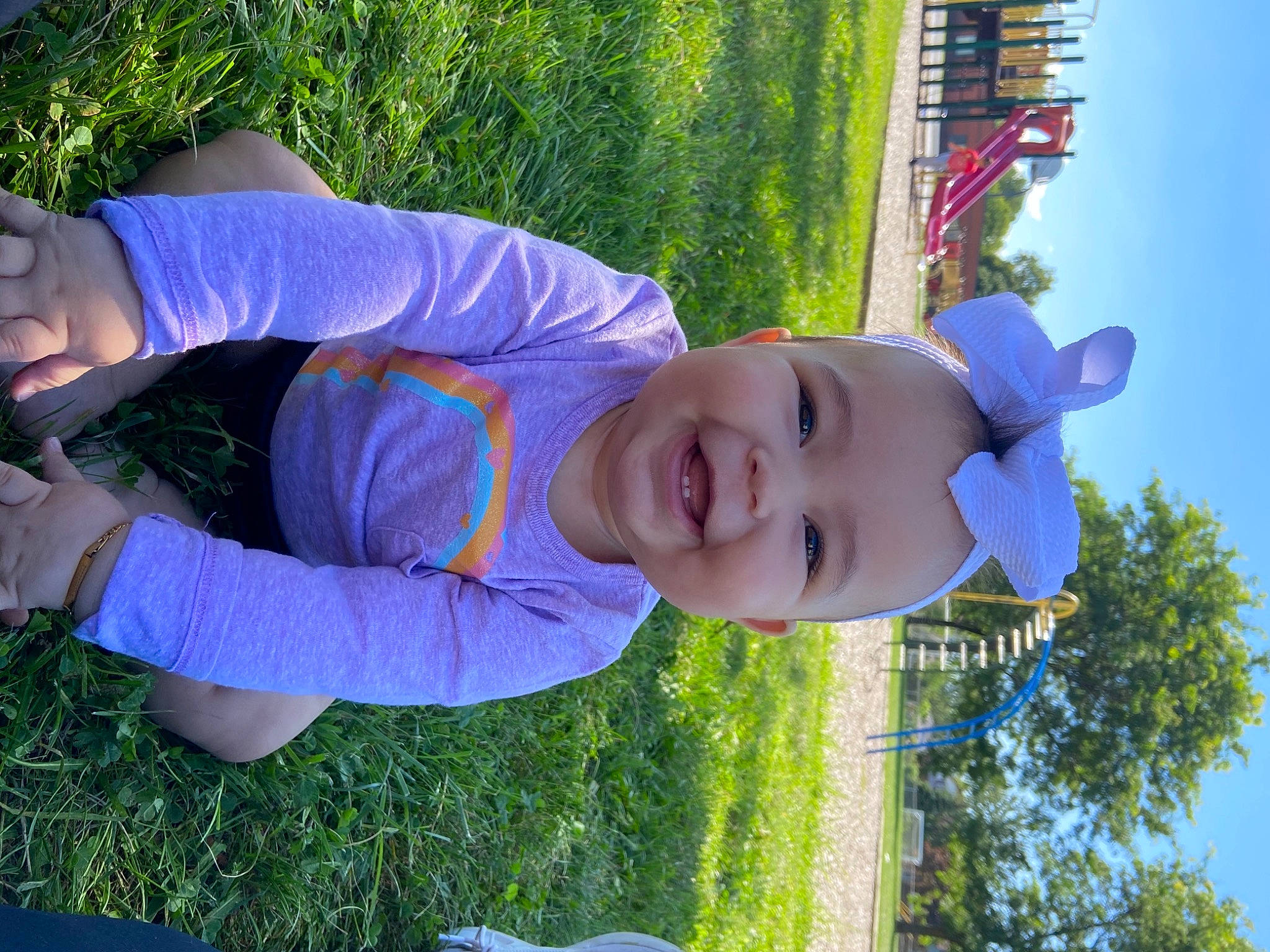 Natalia is registered to the contest to win money with this photo: azure, blue, child, electric_blue, fun, grass, happy, hat, joy, leaf, leisure, people_in_nature, person, plant, recreation, sky, smile, spring, sunlight, t_shirt