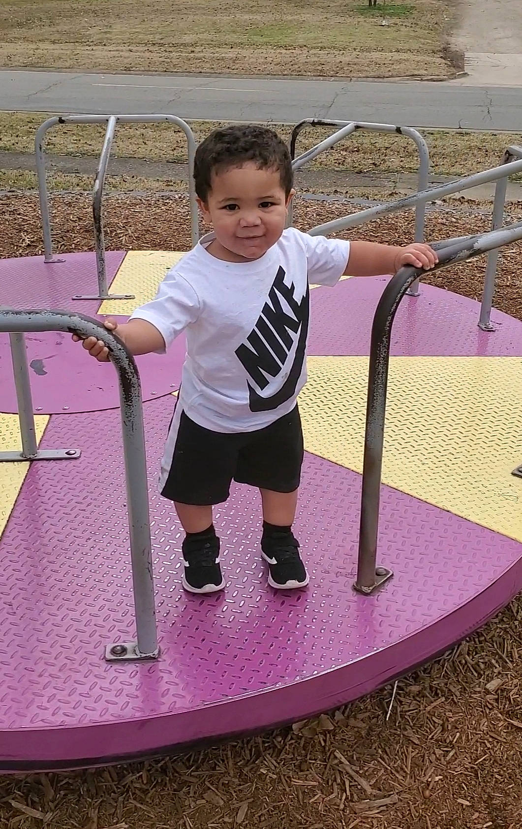 Kaius is registered to the contest to win money with this photo: child, fun, human_settlement, leisure, outdoor_play_equipment, person, pink, play, playground, public_space, recreation, toddler