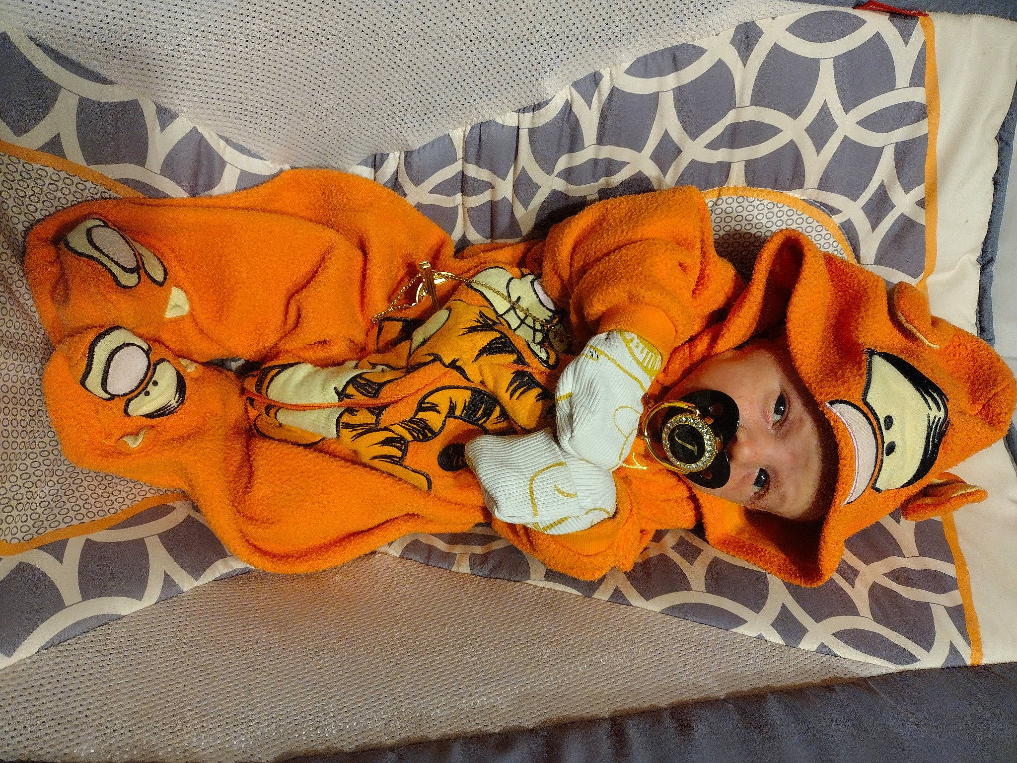 Jackson joined the competition — help win amazing prizes! baby_products, baby_toddler_clothing, carmine, comfort, font, headwear, linens, orange, pattern, peach, person, sleeve