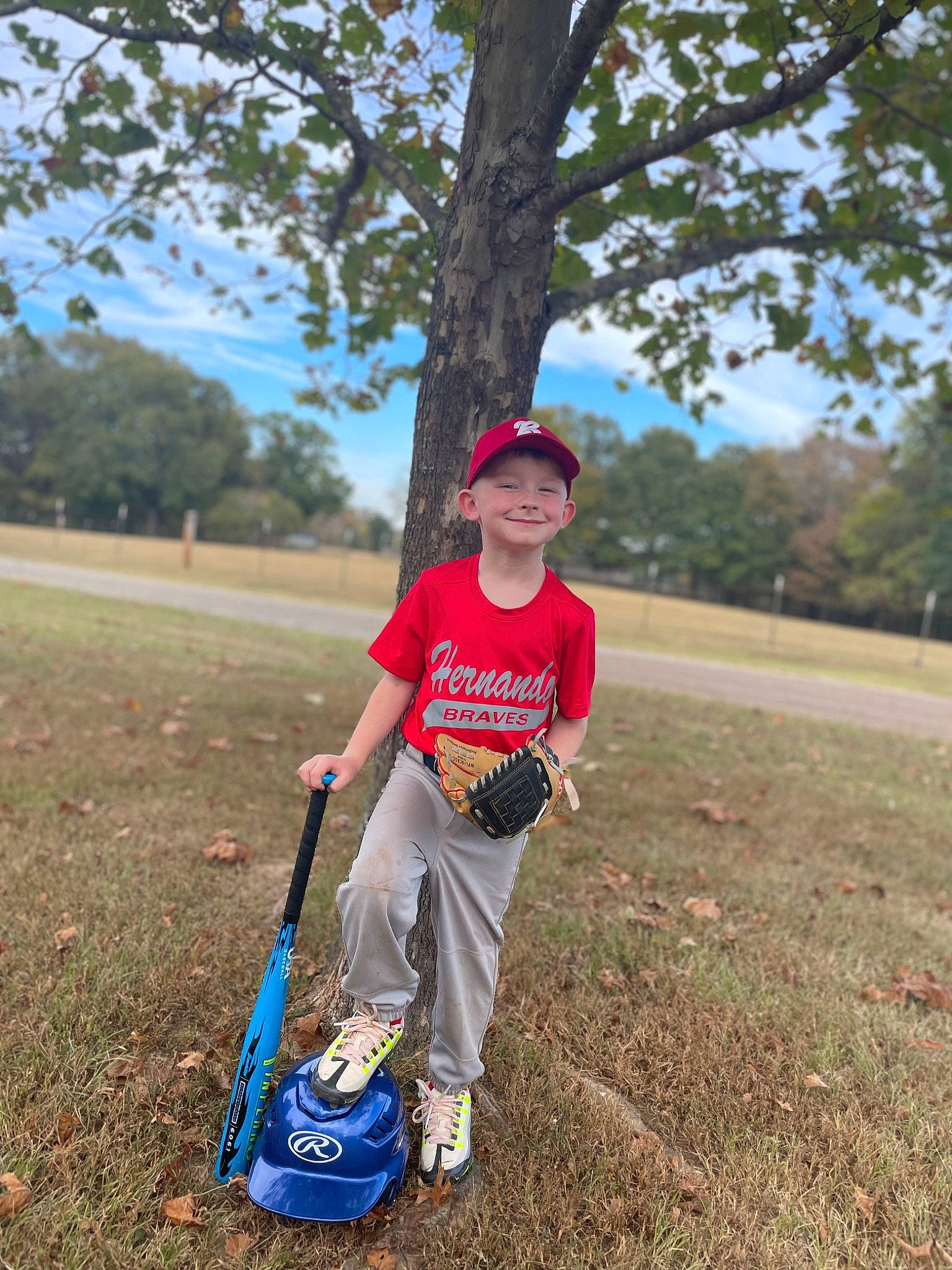 Cameran is registered to the contest to win money with this photo: asphalt, grass, grassland, happy, hat, headwear, joy, landscape, lawn, leaf, leisure, people_in_nature, person, plant, recreation, shorts, sky, soil, t_shirt, tire