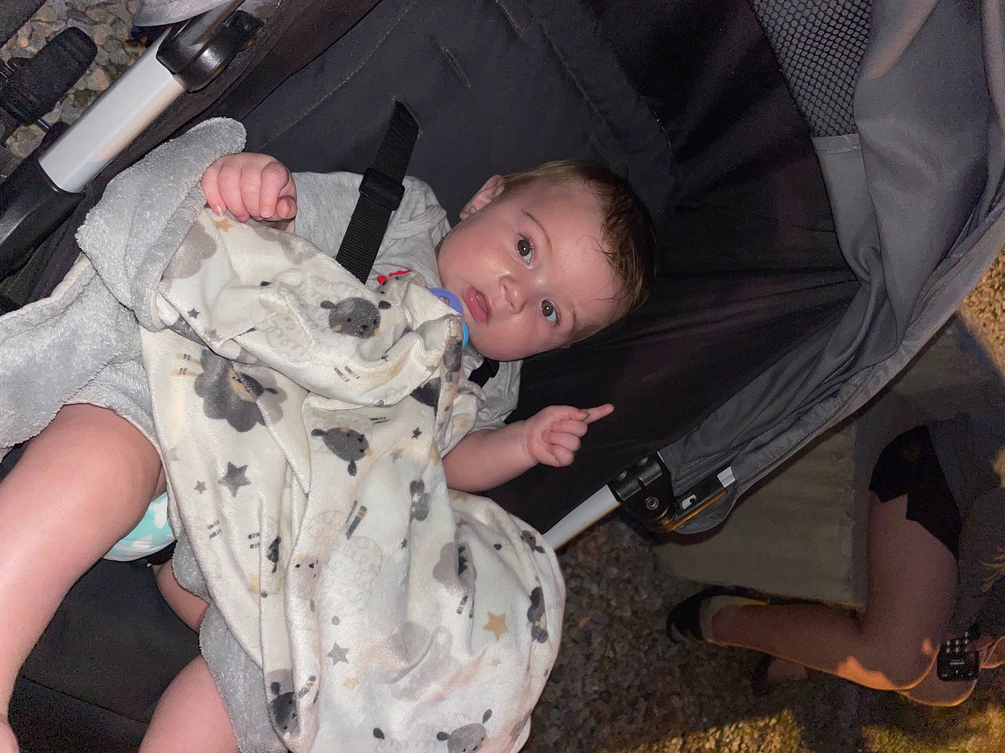 Kevin is registered to the contest to win money with this photo: baby, baby_carriage, baby_toddler_clothing, cheek, child, comfort, eye, fun, human_body, leg, mammal, military_camouflage, mouth, people, person, sitting, skin, thigh, thumb, toddler