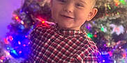 Kevin joined the competition — help win amazing prizes! bokeh, boy, candid, celebration, child, christmas_tree, cozy, cute, family_moment, festive, haircut, holiday_lights, indoors, ornaments, plaid_shirt, portrait, smile, sparkle, toddler, young_child