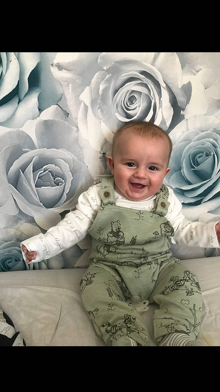 Noah is registered to the contest to win money with this photo: art, baby, baby_toddler_clothing, child, design, flash_photography, flower, font, happy, head, illustration, iris, joy, pattern, person, petal, plant, rose, sleeve, smile