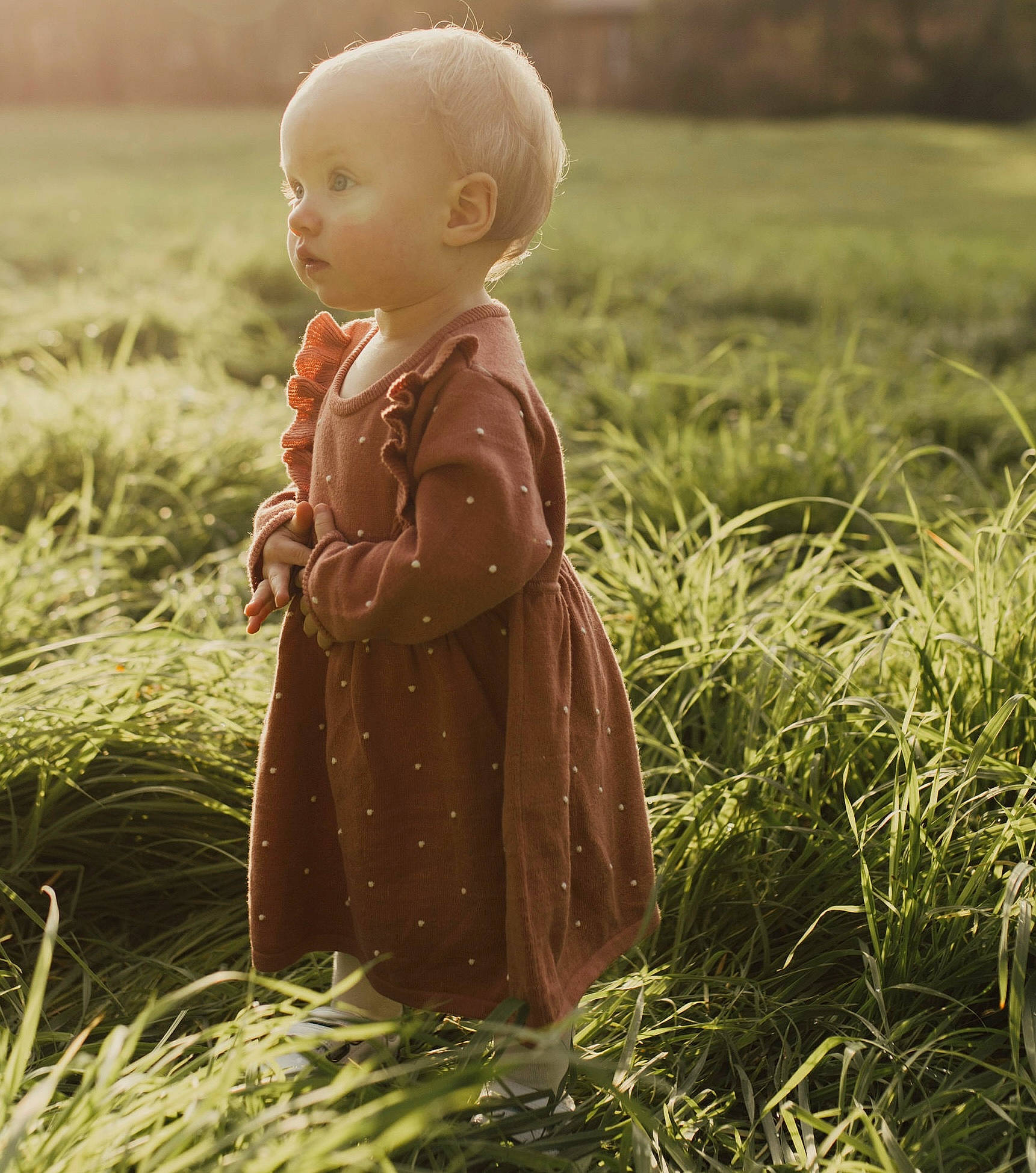 Eva joined the competition — help win amazing prizes! art, baby, blond, child, fun, gesture, grass, grassland, happy, landscape, meadow, natural_landscape, outerwear, people_in_nature, person, prairie, sitting, sleeve, standing, toddler