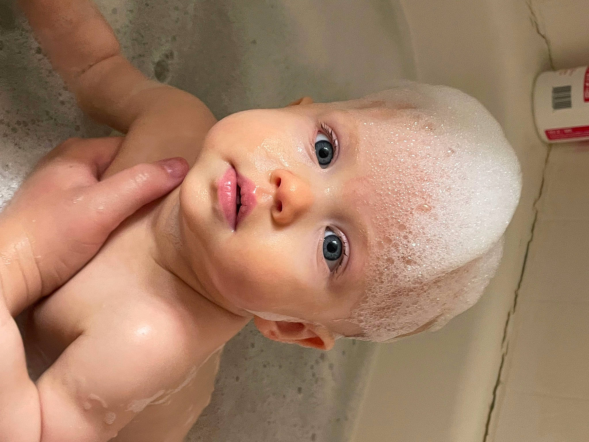 Eva is registered to the contest to win money with this photo: bathing, cheek, chest, ear, eye, eyelash, foam, forehead, hair, hand, human_body, iris, jaw, lip, mouth, neck, nose, person, shoulder, trunk