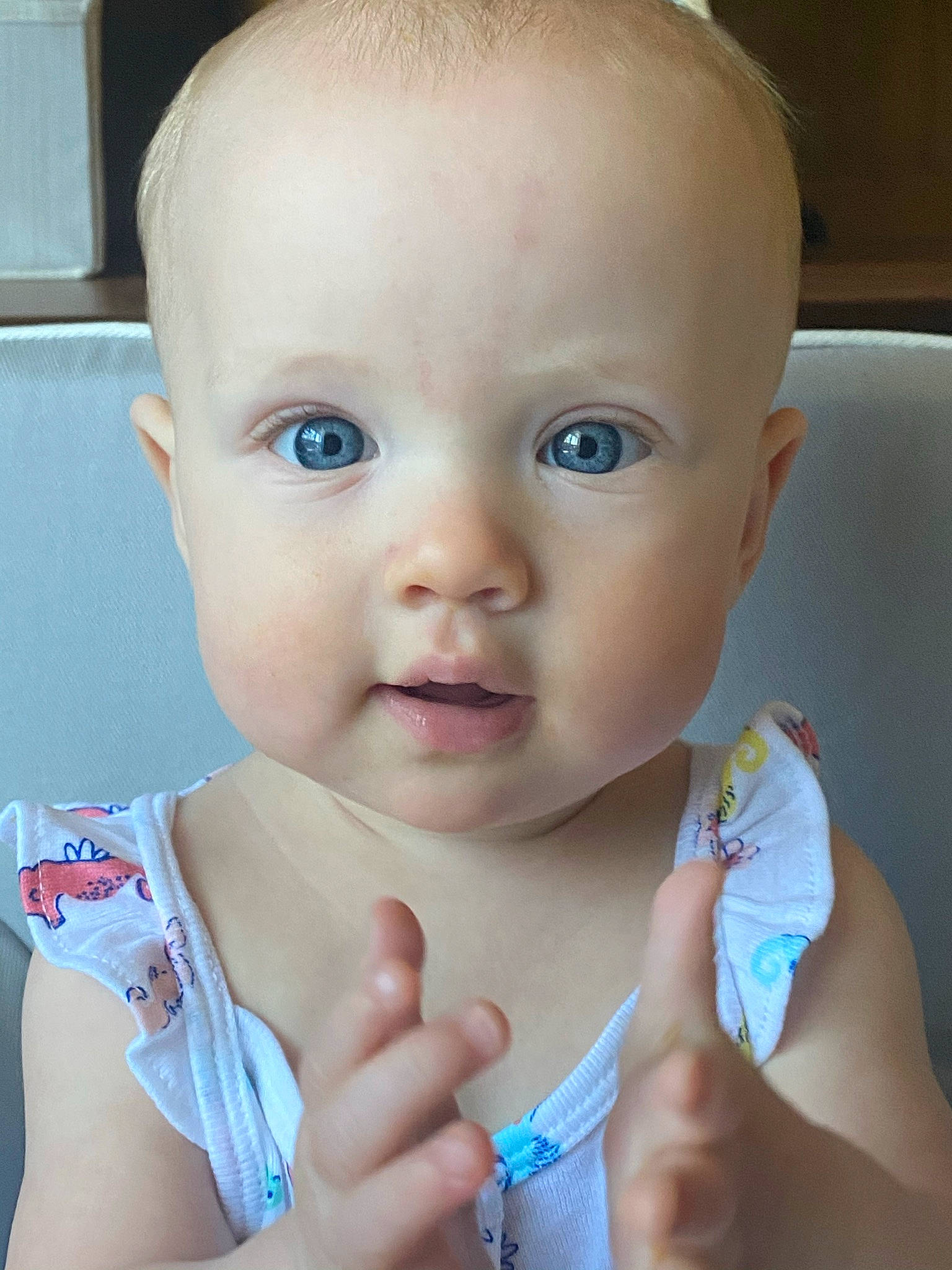 Eva is registered to the contest to win money with this photo: arm, azure, baby_toddler_clothing, cheek, chin, ear, eyebrow, eyelash, hairstyle, hand, iris, joint, lip, mouth, muscle, neck, nose, organ, person, photograph