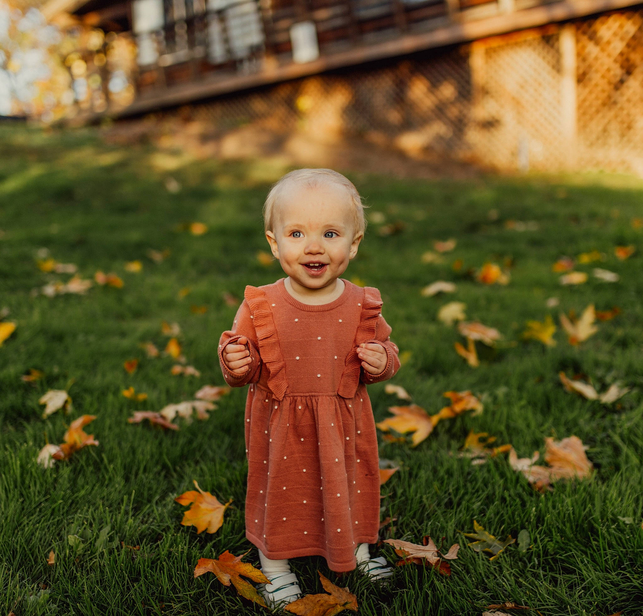 Eva is registered to the contest to win money with this photo: art, baby, child, deciduous, doll, flooring, grass, happy, joy, lawn, leaf, orange, people_in_nature, person, plant, smile, snapshot, sunlight, tints_and_shades, toddler