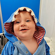 Carter joined the competition — help win amazing prizes! baby, child, hood, towel, blue, striped, smile, face, happy, cute, indoor, portrait, clothing, infant, young_child, cheerful, eyes, person, warm, soft
