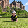 Carter joined the competition — help win amazing prizes! baby, child, crawling, grass, castle, building, sky, cloud, hat, jersey, outdoor, greenery, summer, daylight, smile, nature, historic, architecture, person, landscape