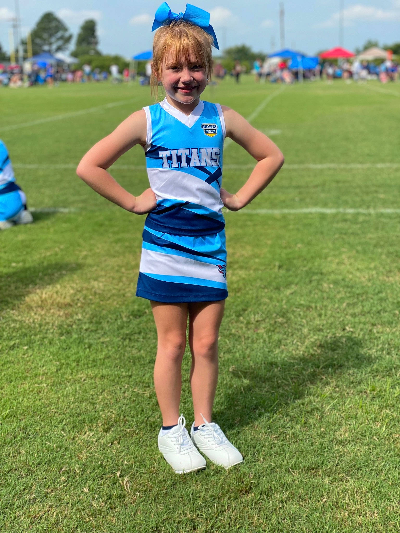 Alee is registered to the contest to win money with this photo: blue, championship, cheerleading_uniform, cloud, competition_event, electric_blue, fun, grass, grassland, happy, joy, leisure, person, player, sky, smile, sports, sports_uniform, sportswear, summer