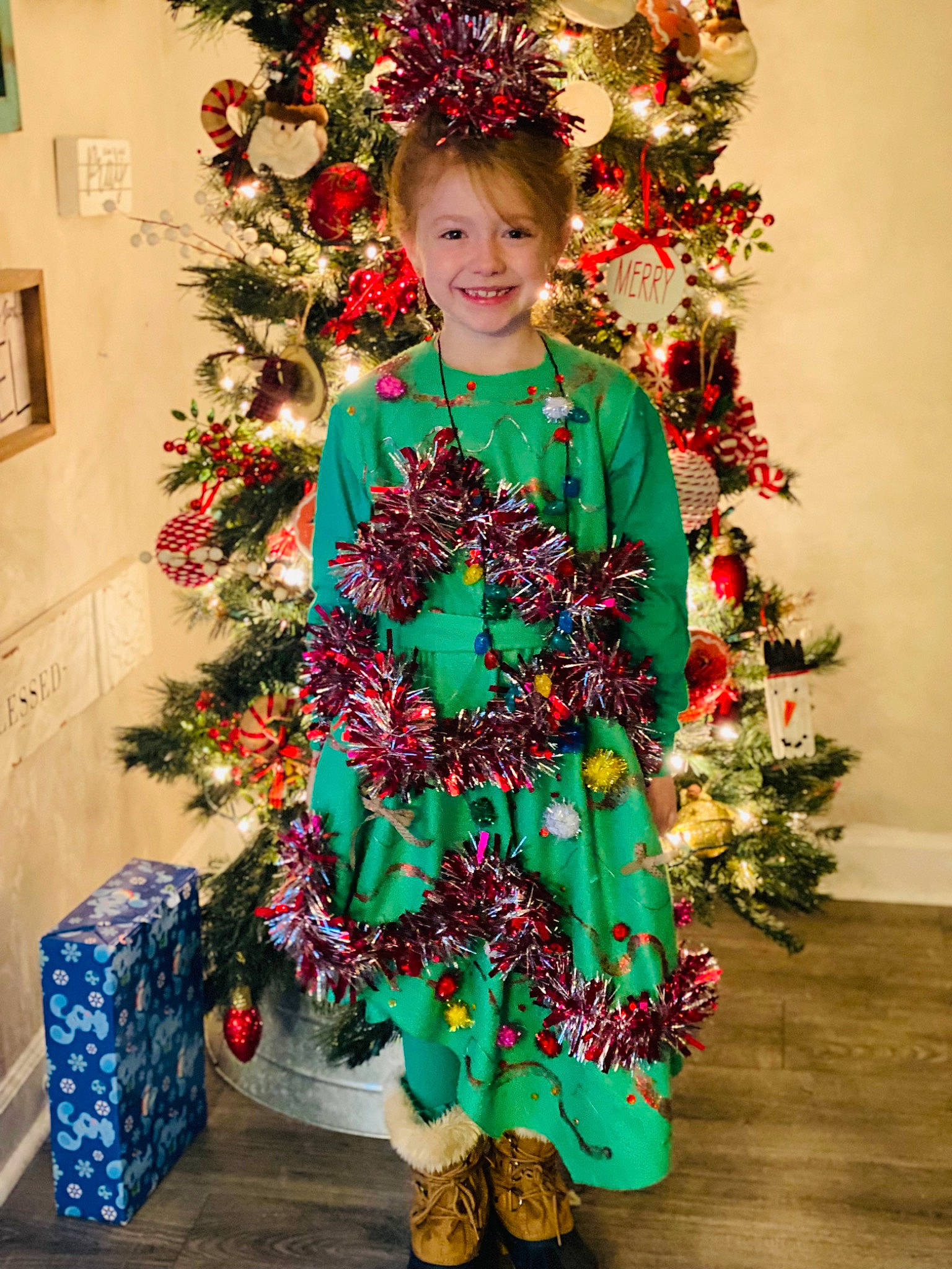 Alee joined the competition — help win amazing prizes! christmas, christmas_decoration, christmas_eve, christmas_ornament, christmas_tree, conifer, creative_arts, event, evergreen, face, floral_design, happy, holiday, holiday_ornament, joy, ornament, person, plant, red, smile