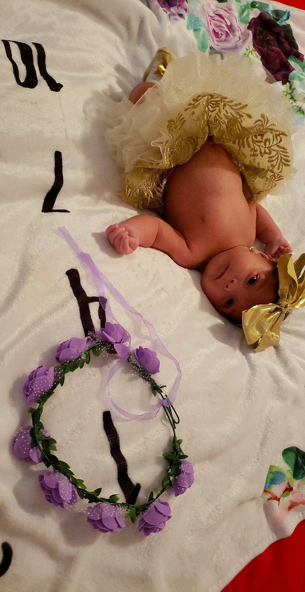 Camilla joined the competition — help win amazing prizes! baby, baby_sleeping, baby_toddler_clothing, bed, bedding, comfort, cut_flowers, flower, hair_accessory, headgear, headpiece, headwear, linens, magenta, person, petal, pink, purple, textile, toddler