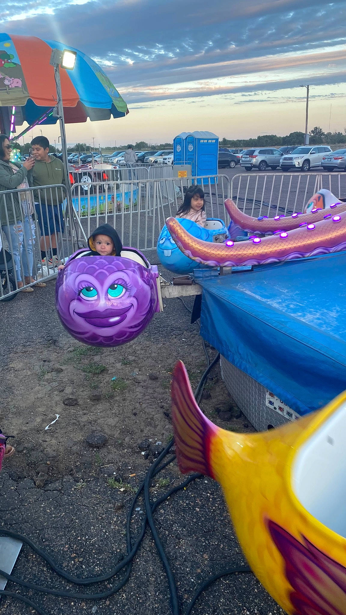 Korbyn is registered to the contest to win money with this photo: automotive_tire, blue, boats_and_boating_equipment_and_supplies, city, electric_blue, event, fun, headwear, joy, landscape, leisure, light, magenta, mode_of_transport, morning, motor_vehicle, natural_environment, person, purple, recreation