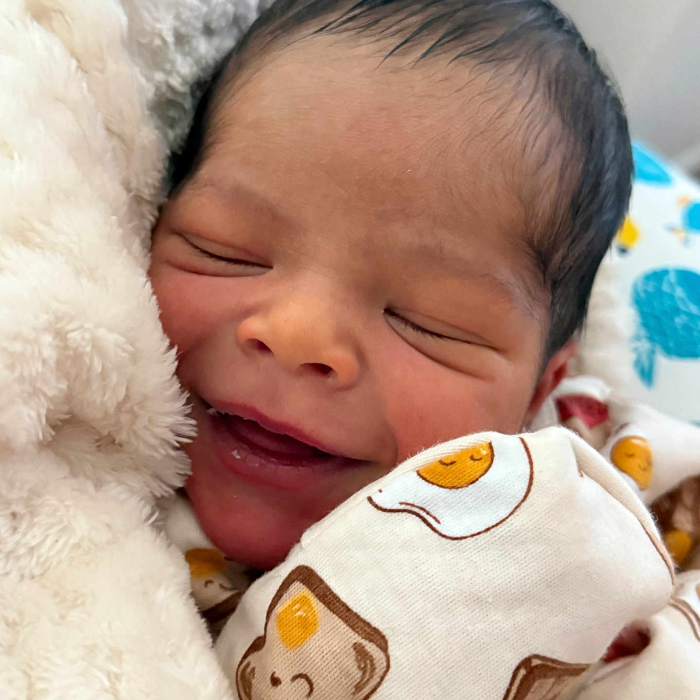 Elijah Kahlil is registered to the contest to win money with this photo: adorable, baby, bed, blanket, child, closeup, clothing, cozy, cute, face, infant, newborn, pattern, peaceful, portrait, resting, sleeping, smiling, soft, wrapped