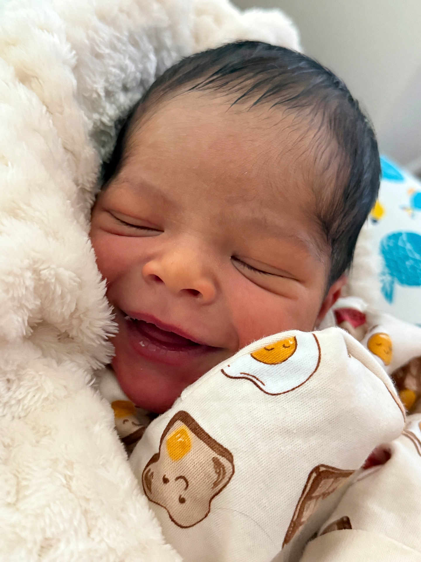 Elijah Kahlil is registered to the contest to win money with this photo: newborn, baby, sleeping, smiling, blanket, cozy, infant, cute, soft, face, wrapped, clothing, pattern, bed, peaceful, closeup, portrait, adorable, resting, child