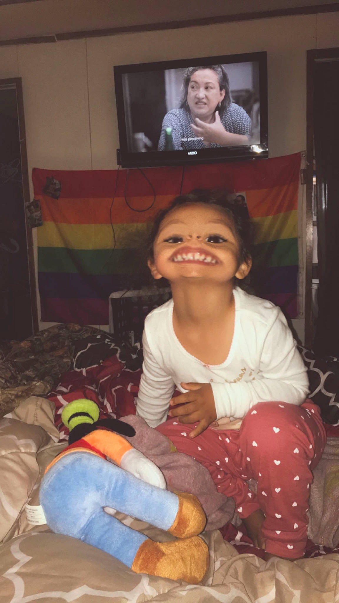 Greyson joined the competition — help win amazing prizes! baby_toddler_clothing, cheek, child, comfort, eye, facial_expression, hairstyle, head, human, human_body, lap, mouth, nose, person, picture_frame, room, sitting, sock, television_set, toddler