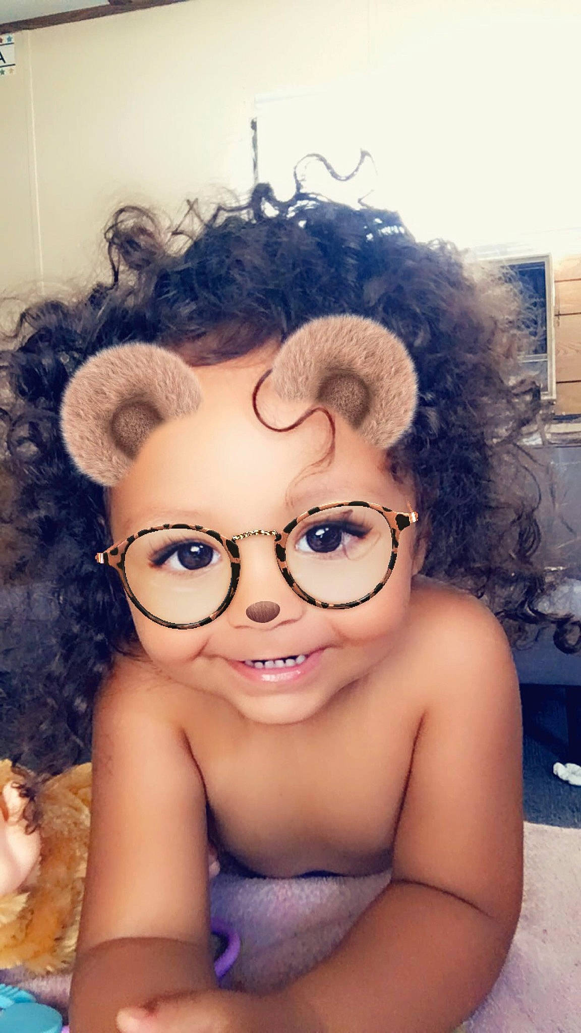 Greyson is registered to the contest to win money with this photo: afro, brown_hair, cheek, child_model, cool, eyebrow, eyelash, hairstyle, jheri_curl, person, photography, ringlet, toy