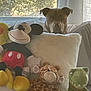 Rusty joined the competition — help win amazing prizes! dog, stuffed_animal, pillow, mickey_mouse, giraffe, dinosaur, window, curtains, indoor, plush_toys, brown_dog, greenery, couch, sunlight, pet, toys, home, soft_toys, animal, relaxing