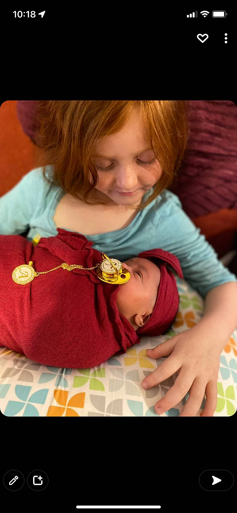 Amira joined the competition — help win amazing prizes! arm, baby, baby_toddler_clothing, cheek, child, comfort, facial_expression, finger, hand, happy, head, joy, linens, person, pink, product, sitting, skin, sleeve, smile