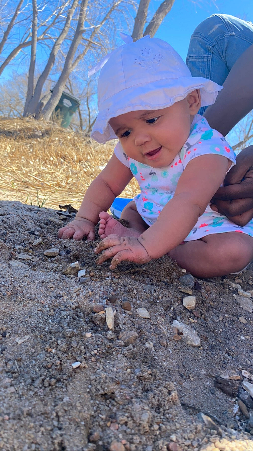 Amira is registered to the contest to win money with this photo: baby, baseball_cap, cap, child, electric_blue, eye, fun, grass, happy, hat, headwear, leaf, leisure, people_in_nature, person, recreation, smile, soil, sun_hat, toddler