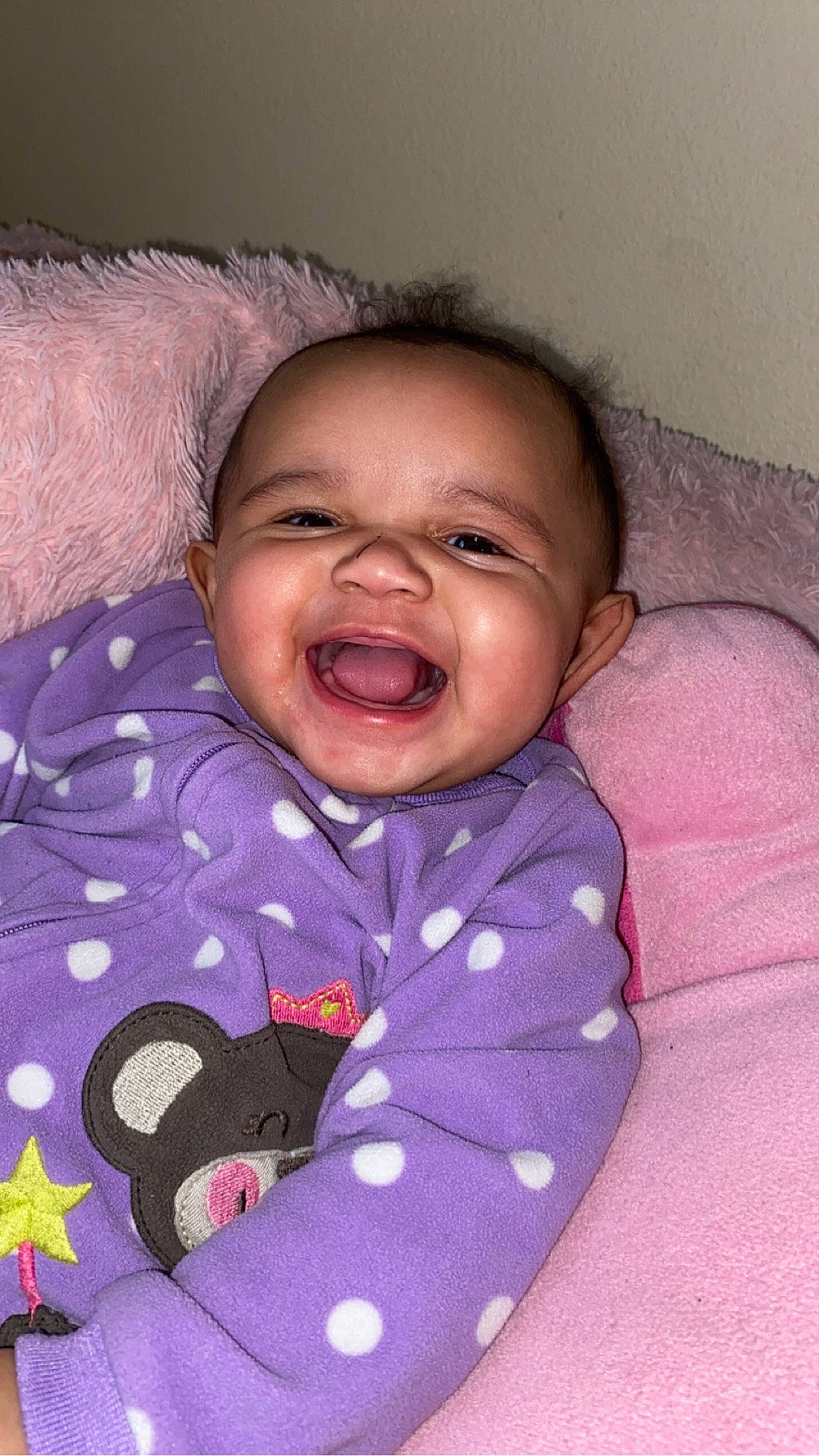 Amira joined the competition — help win amazing prizes! baby, baby_laughing, baby_toddler_clothing, cheek, child, clothing, comfort, fun, happy, human_body, iris, linens, mouth, nose, person, pink, purple, skin, sleeve, smile