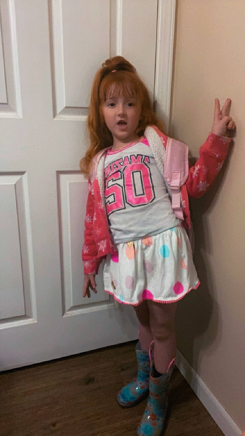 Avianna is registered to the contest to win money with this photo: arm, baby_toddler_clothing, blond, fashion_design, joint, knee, leg, long_hair, magenta, neck, pattern, person, pink, shoe, shoulder, sleeve, sock, surprise, t_shirt, thigh