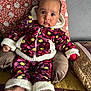 Amreen is registered to the contest to win money with this photo: baby, infant, clothing, floral_pattern, colorful, fuzzy, pajamas, blanket, pillow, bed, feet, face, person, cute, indoors, portrait, looking_at_camera, child, warm, cozy