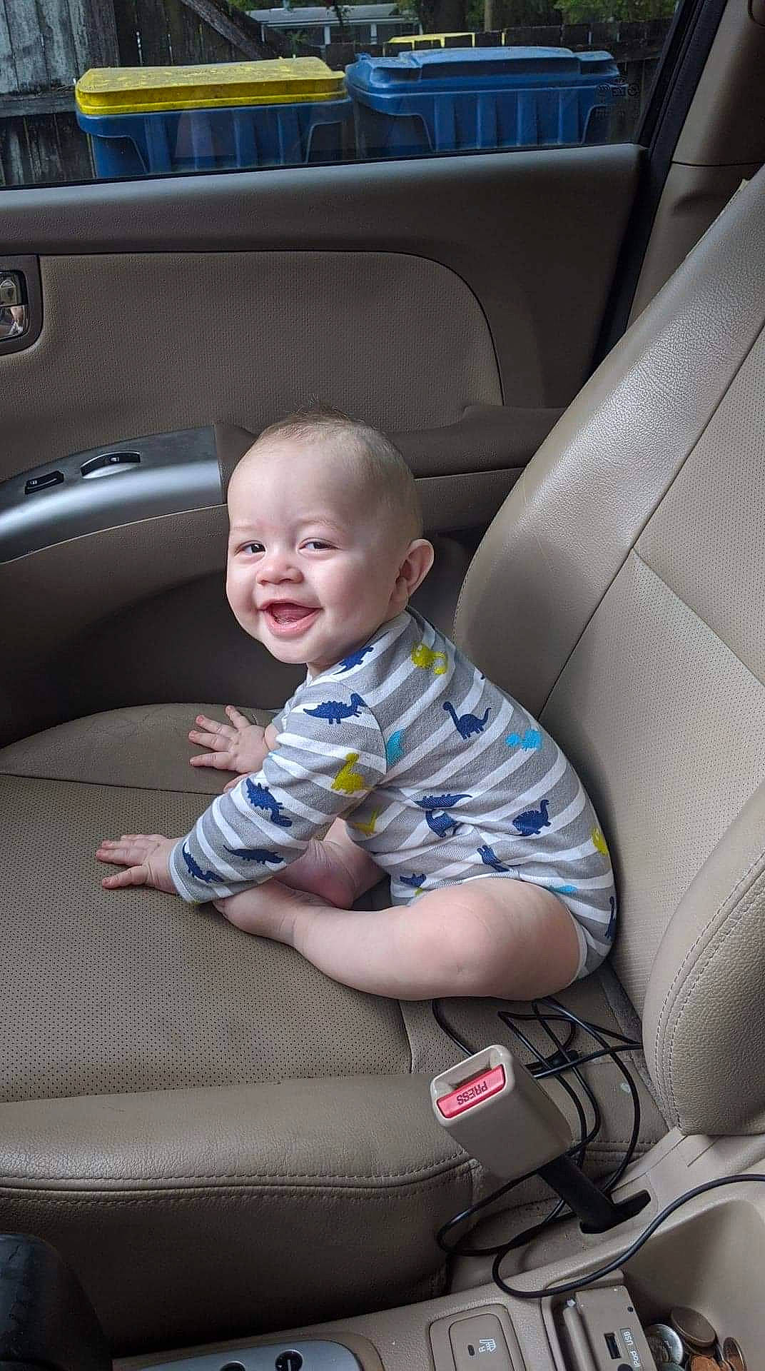 Zavian is registered to the contest to win money with this photo: auto_part, automotive_design, automotive_exterior, baby, bumper, car, car_seat, car_seat_cover, child, comfort, family_car, luxury_vehicle, mammal, motor_vehicle, person, personal_luxury_car, sitting, smile, toddler, vehicle