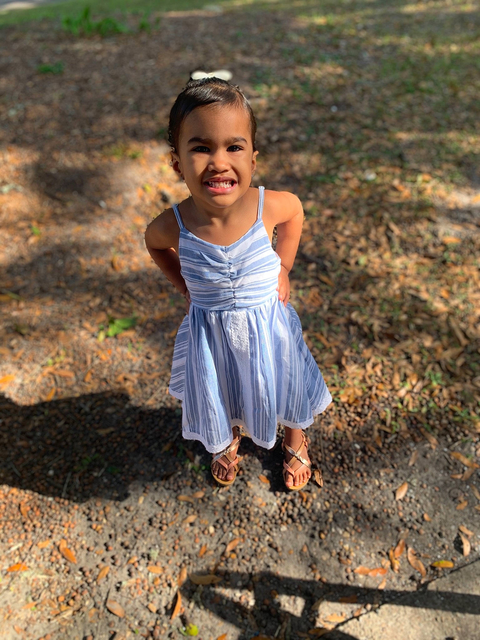 Jayde is registered to the contest to win money with this photo: adaptation, baby_toddler_clothing, body_of_water, dress, eye, face, flash_photography, grass, hair, hand, happy, head, joy, landscape, natural_environment, people_in_nature, person, plant, smile, sunlight