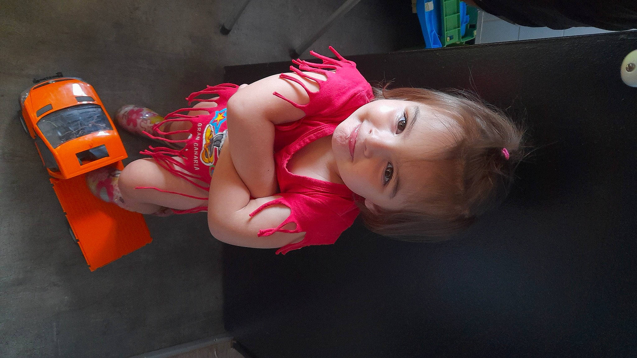 Leana participe au concours pour gagner de l'argent avec cette photo : abdomen, auto_part, automotive_design, automotive_exterior, automotive_lighting, automotive_wheel_system, blond, bumper, carmine, chest, costume, flash_photography, fun, human_leg, joy, long_hair, magenta, person, sportswear, thigh