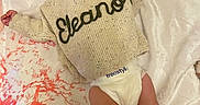 Eleanor joined the competition — help win amazing prizes! baby, child, smiling, headband, pink, bow, sweater, knitted, name, blanket, pattern, orange, white, happy, pose, diaper, infant, cute, lying_down, soft