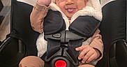 Syilynne joined the competition — help win amazing prizes! baby, brown_pajamas, car_seat, child, cozy_clothing, cute, fabric, flower_headband, happy, hood, indoor, infant, playful, safety, seatbelt, sitting, smiling, soft, tongue_out, young_child