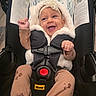 Syilynne joined the competition — help win amazing prizes! baby, infant, car_seat, smiling, hooded_jacket, clothing, child, seatbelt, happy, indoor, person, cute, headband, fuzzy, infant_clothing, safety, car, young_child, cheerful, seat
