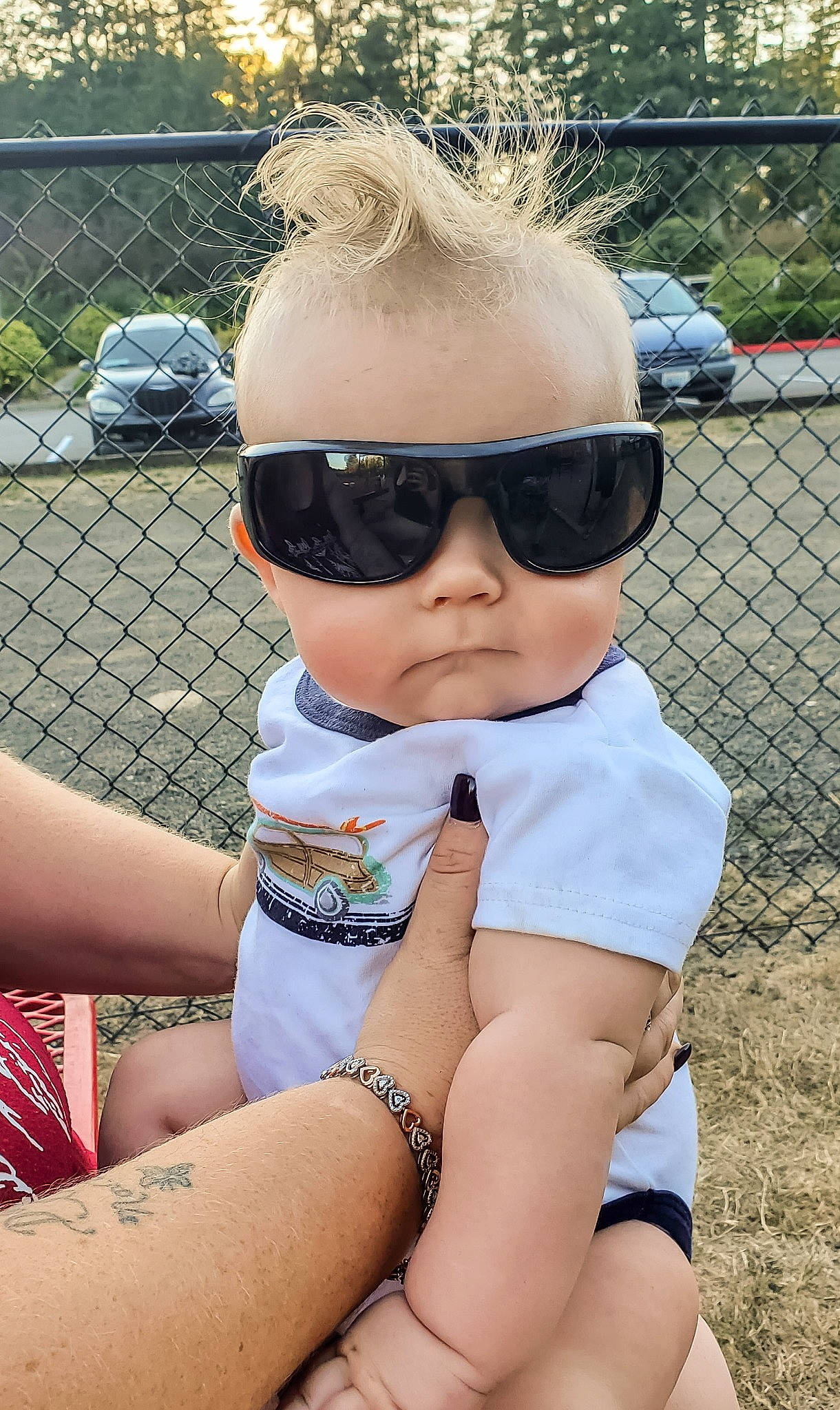 Nathan Jr is registered to the contest to win money with this photo: blond, child, cool, eyewear, fun, glasses, grass, hair, hairstyle, leg, leisure, lip, person, summer, sunglasses, thigh, toddler, vacation, vision_care