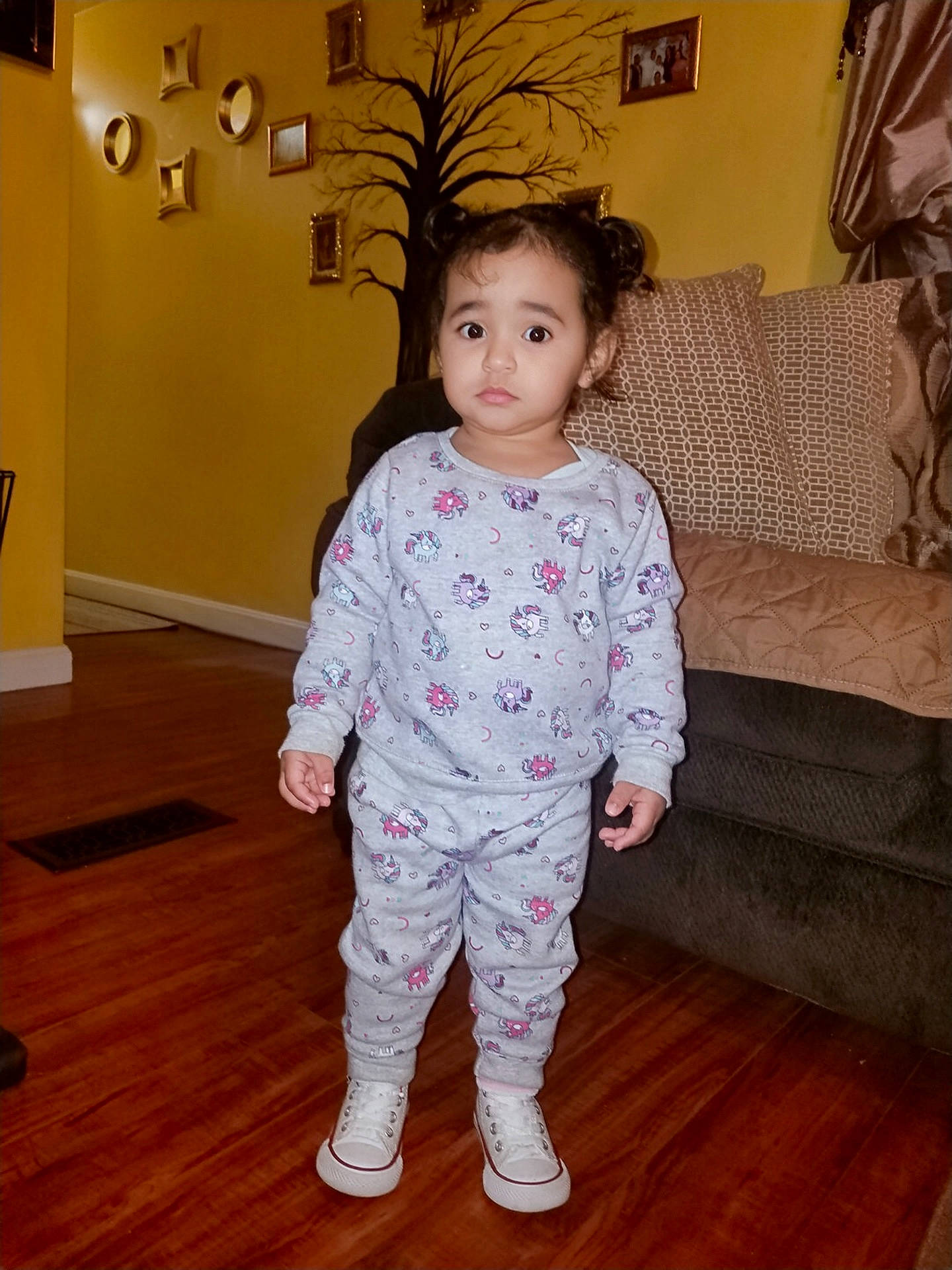 Mia Catalia Rivera is registered to the contest to win money with this photo: baby, child, clothing, outerwear, pajamas, person, sleeve, smile, standing, toddler