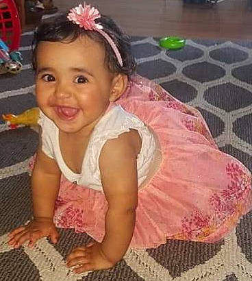 Mia Catalia Rivera joined the competition — help win amazing prizes! baby, child, child_model, dress, fashion_accessory, hair_accessory, headband, headgear, joy, pattern, person, pink, play, smile, textile, toddler