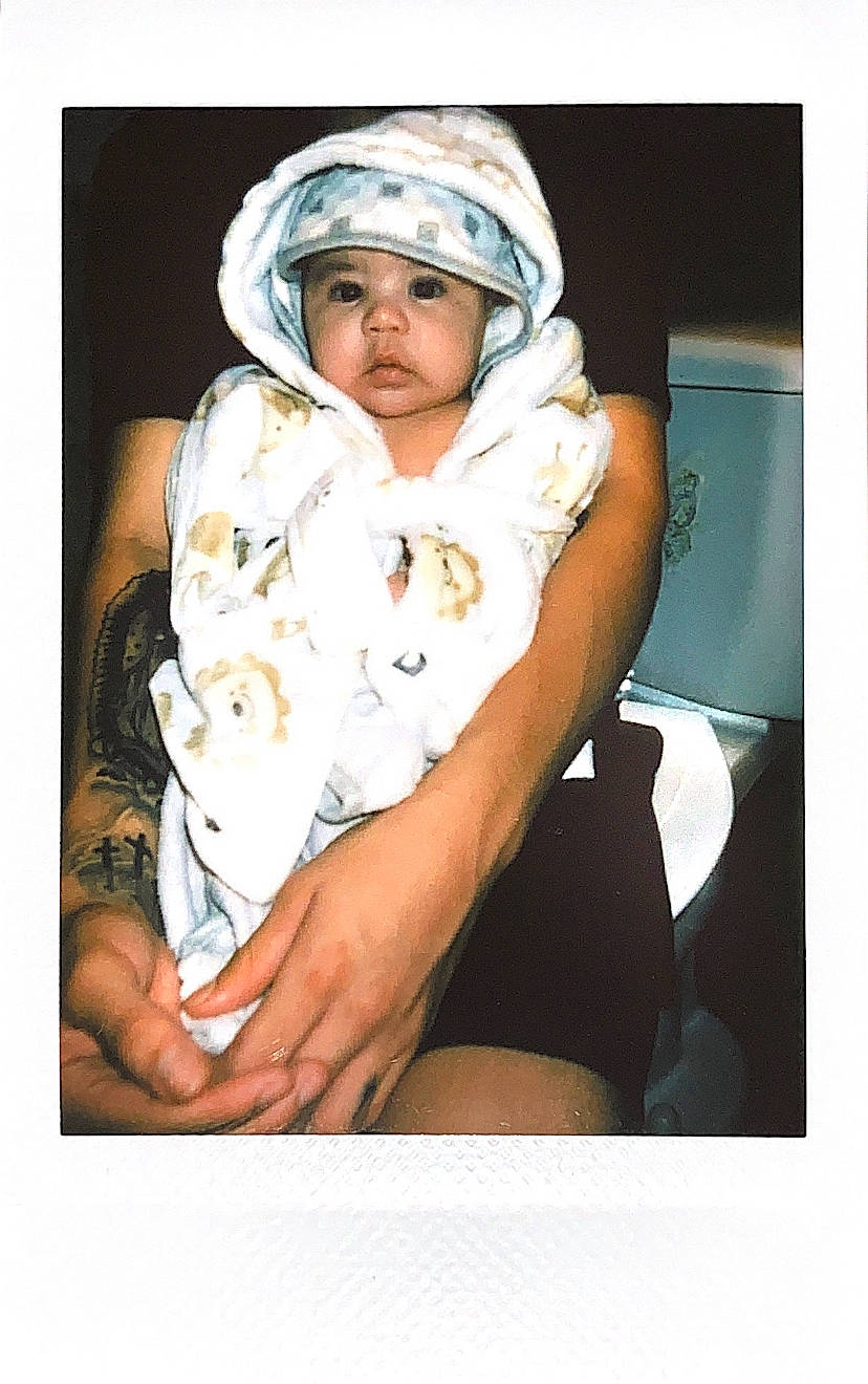 Ezequiel joined the competition — help win amazing prizes! baby, cap, child, comfort, event, fashion_accessory, flash_photography, fur, gesture, headwear, linens, person, portrait, portrait_photography, room, sitting, sleeve, stock_photography, toddler