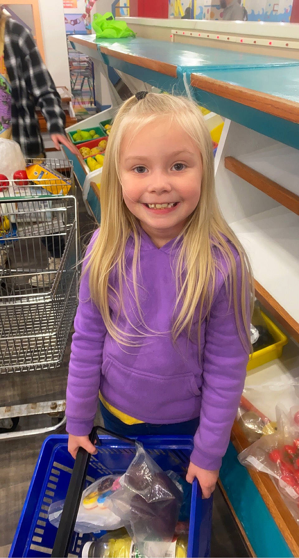 Jacey joined the competition — help win amazing prizes! arm, blond, blue, child, clothing, customer, electric_blue, fun, happy, joy, leisure, person, plastic_bag, purple, retail, shopping, shopping_cart, sleeve, smile, snapshot