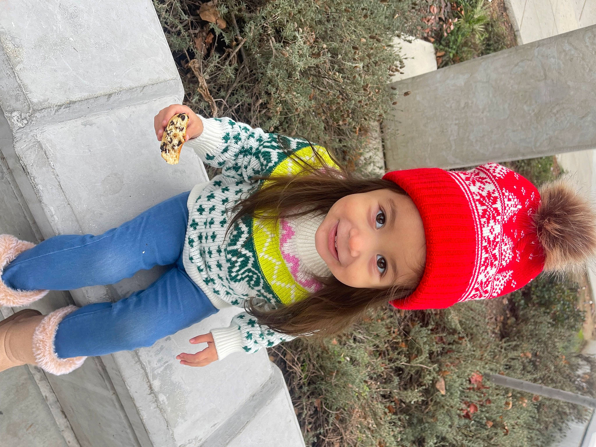 Alison is registered to the contest to win money with this photo: child, clothing, denim, fun, grass, happy, hat, headwear, jeans, joy, leisure, magenta, pattern, person, plant, sitting, smile, textile, toddler, tree