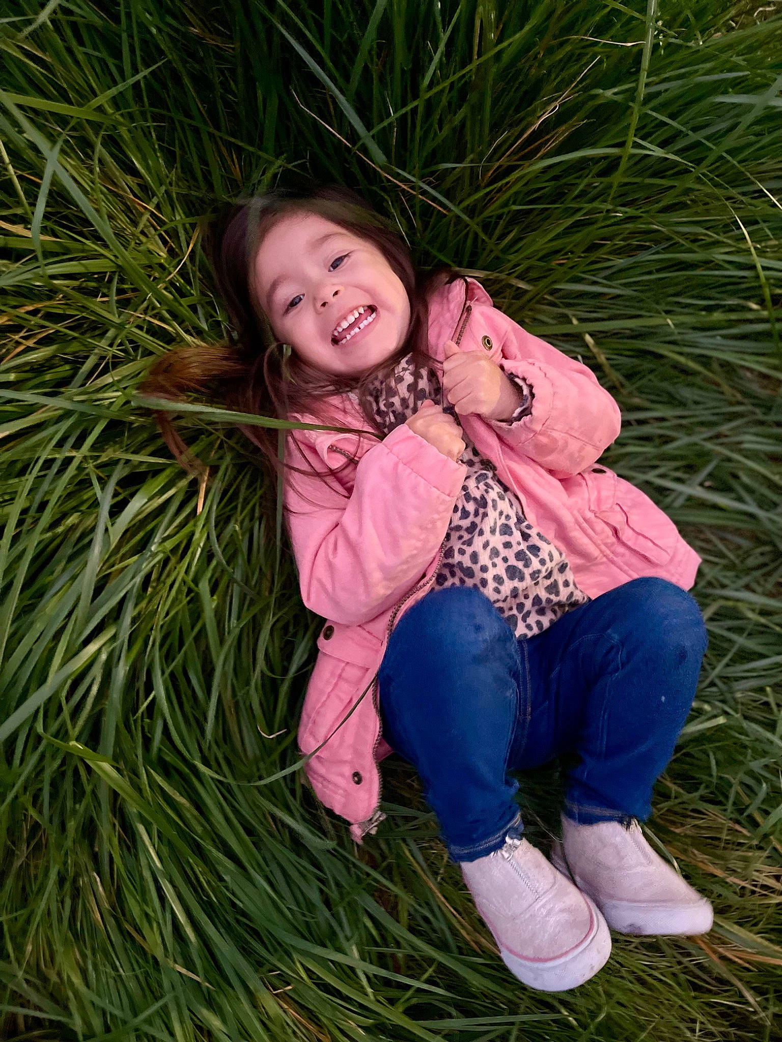 Alison is registered to the contest to win money with this photo: baby_toddler_clothing, child, eye, facial_expression, fun, grass, hair, hand, happy, head, human_body, joy, leaf, leg, outerwear, people_in_nature, person, plant, skin, smile