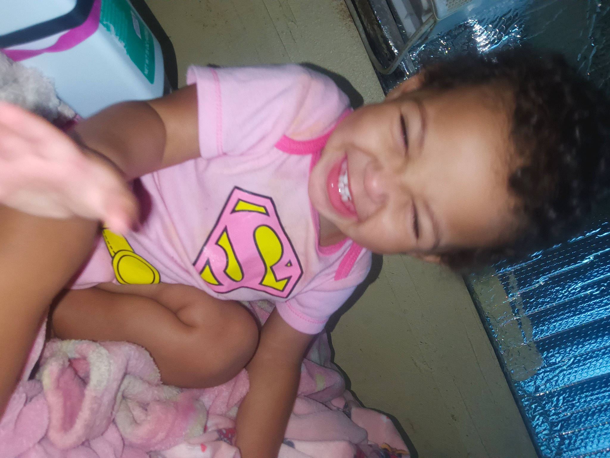 Elaina is registered to the contest to win money with this photo: arm, baby_toddler_clothing, black_hair, cheek, finger, fun, happy, human_leg, joy, leg, mouth, muscle, neck, nose, organ, person, pink, skin, smile, thigh