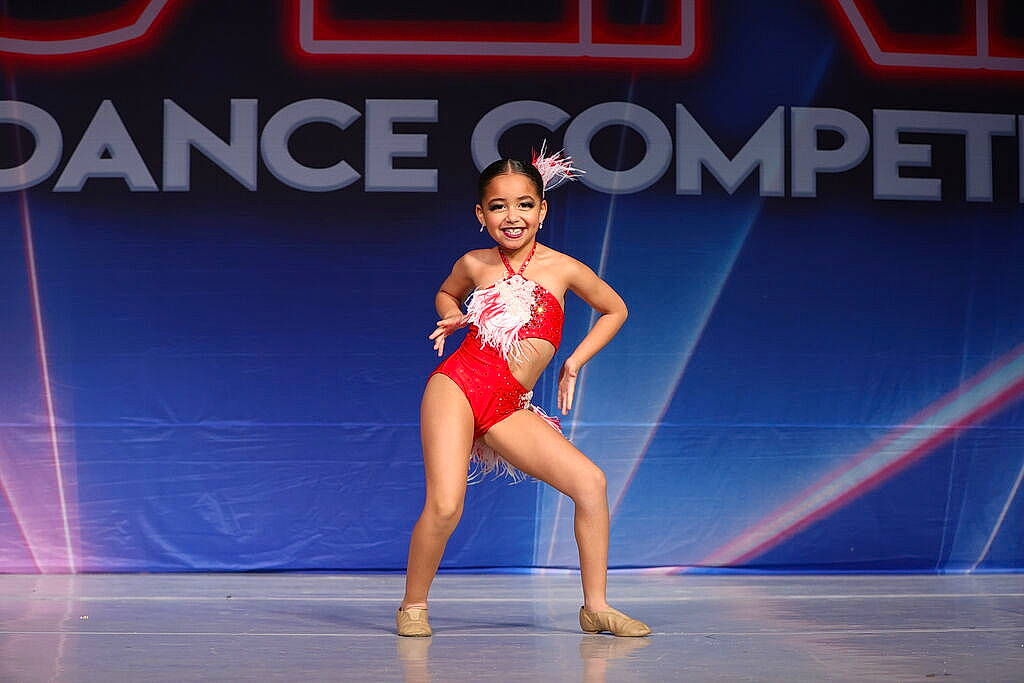 Aleannah is registered to the contest to win money with this photo: arm, artist, barefoot, choreography, competition, competition_event, dance, dancer, electric_blue, entertainment, event, human_body, human_leg, joy, performance_art, performing_arts, person, rhythmic_gymnastics, smile, sports