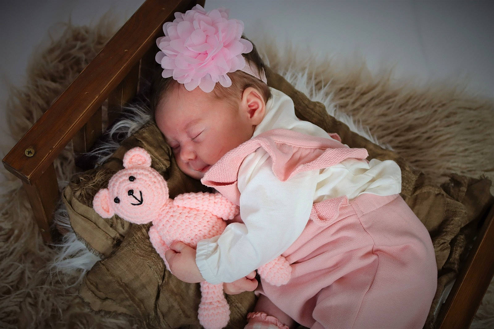 Lottie is registered to the contest to win money with this photo: baby, baby_toddler_clothing, cheek, child, clothing, comfort, dress, eye, head, headgear, human_body, iris, lip, mammal, person, petal, pink, skin, textile, toddler
